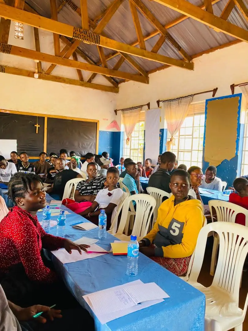 Students listening during a Serenity Minds mental health talk in a school hall